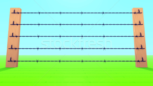 Barb Wire Fence against blue sky. Stock photo © dengess