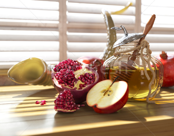 Honey jar with apples and pomegranate for Jewish New Year Holiday rosh hashanah Stock photo © denisgo