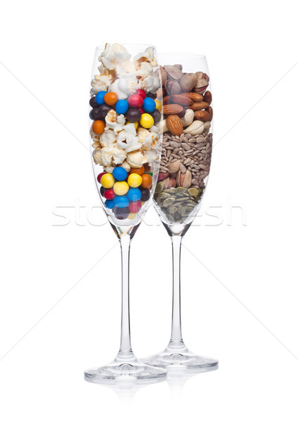 Popcorn and candies glass with healthy nuts glass Stock photo © DenisMArt