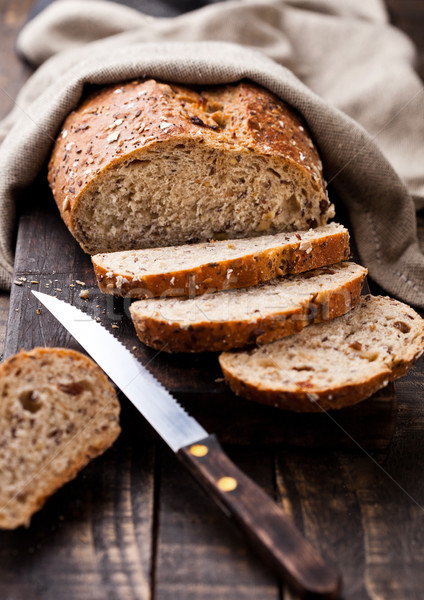 Freshly baked  bread with kitchen towel and knife Stock photo © DenisMArt