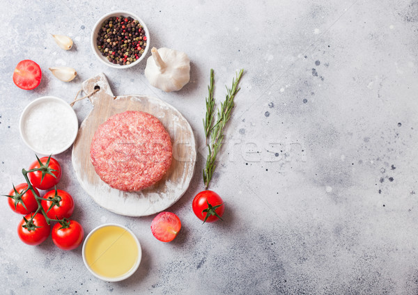 Raw minced homemade grill beef burger with spices and herbs. Top view and space for text.On top of c Stock photo © DenisMArt