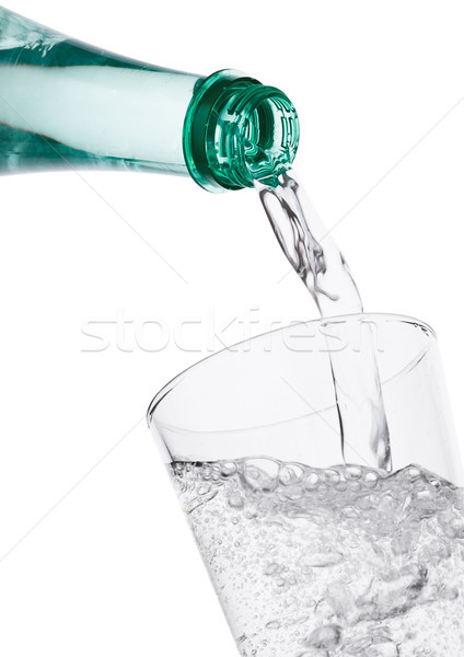 Pouring sparkling mineral water from bottle Stock photo © DenisMArt