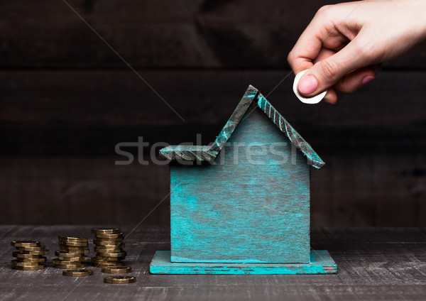 Legno casa modello monete mano testo Foto d'archivio © DenisMArt