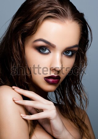 Young beautiful fashion model wearing black dress Stock photo © DenisMArt