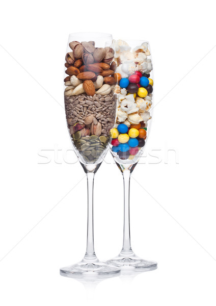 Popcorn and candies glass with healthy nuts glass Stock photo © DenisMArt