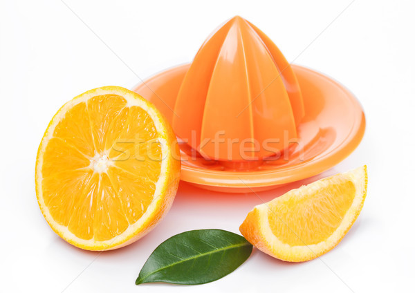 Fresh raw peeled oranges with juice squeezer  Stock photo © DenisMArt