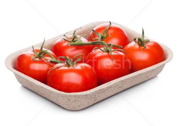 Tray with fresh raw organic tomatoes on white Stock photo © DenisMArt