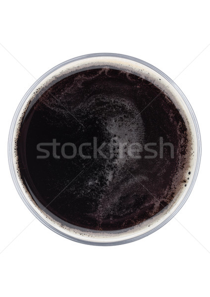 Glass of dark stout beer top view with foam Stock photo © DenisMArt