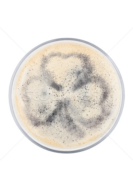 Stock photo: Glass of stout beer top with shamrock shape