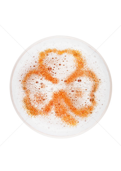 Glass of lager ale beer top with shamrock shape Stock photo © DenisMArt