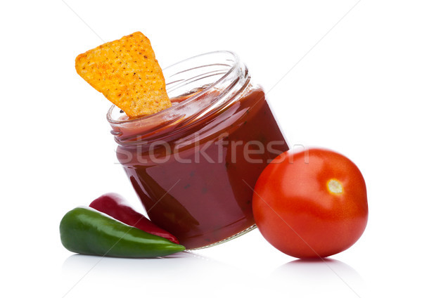 Glass container with hot pepper salsa dip nachos Stock photo © DenisMArt