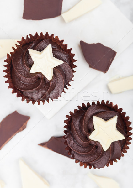 Dark chocolate cupcakes with white star on marble Stock photo © DenisMArt
