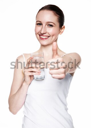 Beautiful girl holding glass with still healthy water Stock photo © DenisMArt