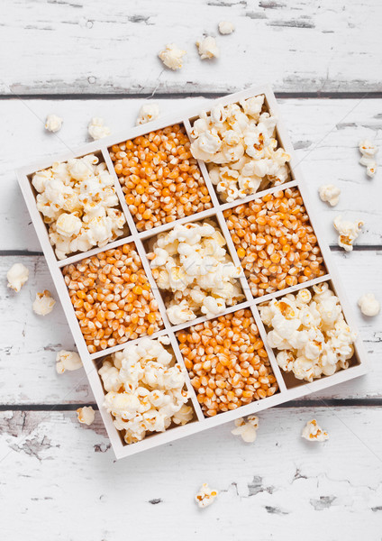 Raw golden sweet corn seeds and popcorn in box Stock photo © DenisMArt