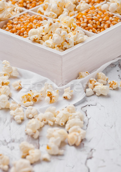 Raw golden sweet corn seeds and popcorn in box Stock photo © DenisMArt