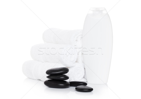 Plastic bottle of organic shampoo with spa towels Stock photo © DenisMArt