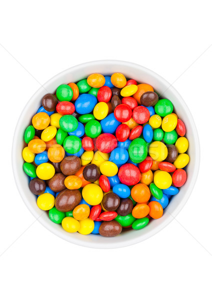 Round colorful coated sweet candies in white bowl Stock photo © DenisMArt