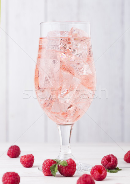 Glass of cold raspberry cider with ice cubes Stock photo © DenisMArt