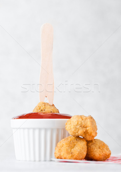 Fried crispy chicken popcorn with ketchup sauce Stock photo © DenisMArt