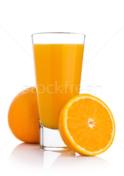 Glass of fresh orange juice with fruit bits Stock photo © DenisMArt
