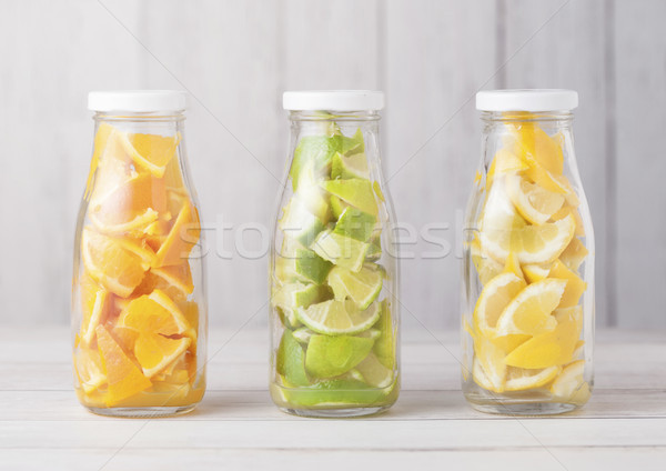 üvegek narancsok citromok szeletek friss nyár Stock fotó © DenisMArt