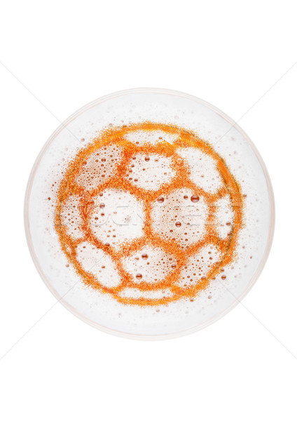 Glass of lager ale beer top with football shape Stock photo © DenisMArt