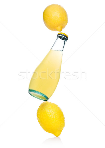 Glass bottle with lemon sparkling soft drink Stock photo © DenisMArt
