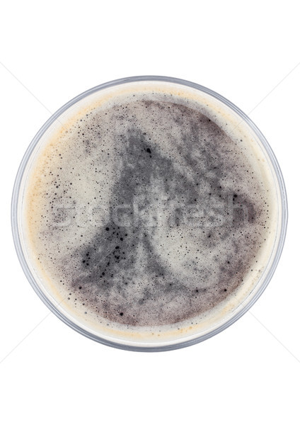 Glass of dark stout beer top view with foam Stock photo © DenisMArt