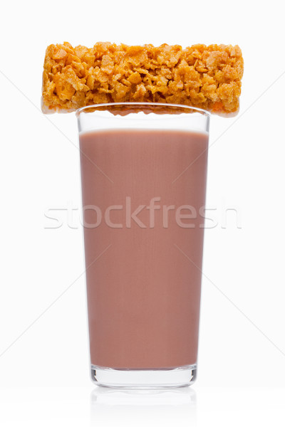 Glass of breakfast chocolate milk with cereal bar Stock photo © DenisMArt