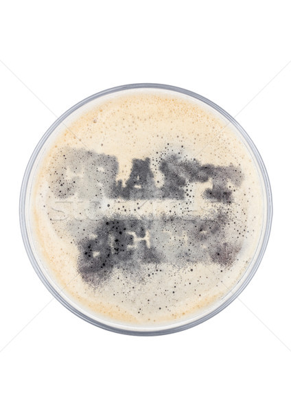 Glass of stout beer top with craft beer shape Stock photo © DenisMArt