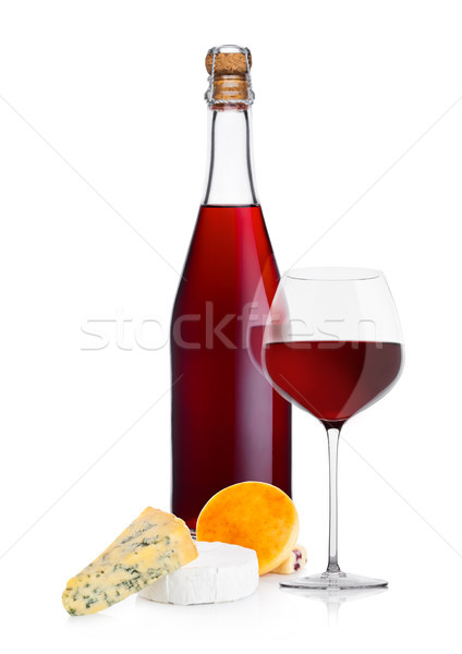 Bottle of homemade red wine with cheese selection Stock photo © DenisMArt