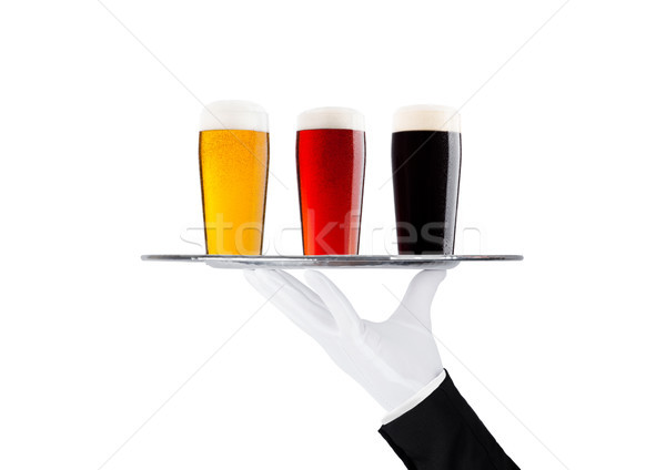 Hand with glove holds tray with lager beer glass Stock photo © DenisMArt