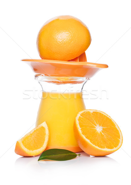 Stock photo: Fresh raw peeled oranges with juice squeezer jar