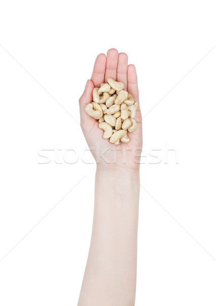 Female hand hold healthy bio cashew nuts Stock photo © DenisMArt