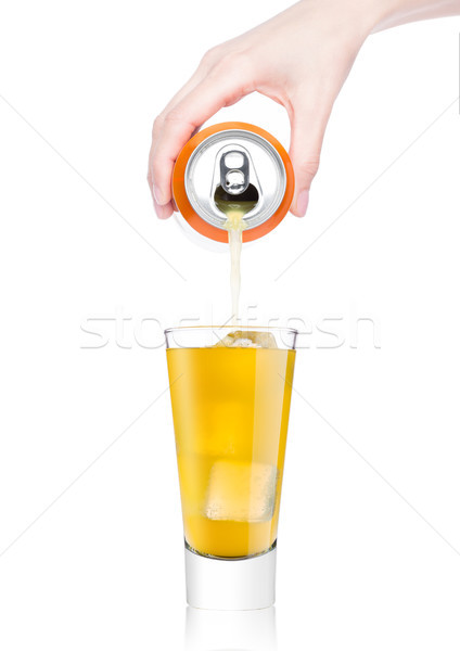 Female hand pouring orange soda from can to glass Stock photo © DenisMArt