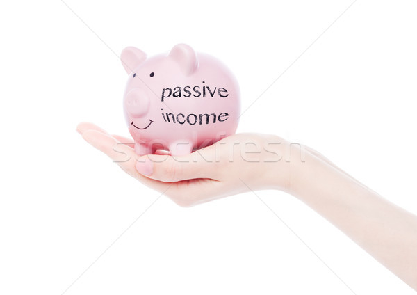Weiblichen Hand Sparschwein passive Einkommen Text Stock foto © DenisMArt