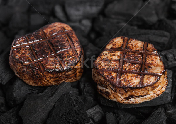 Grilled juicy beef pork steak on barbecue coil Stock photo © DenisMArt