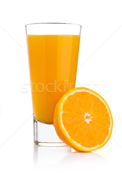 Glass of fresh orange juice with fruit bits Stock photo © DenisMArt