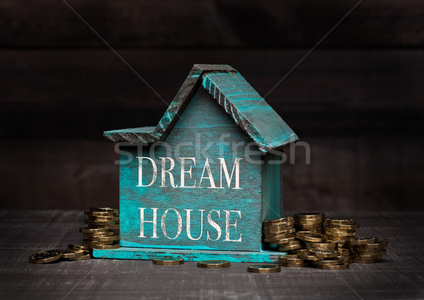 Fából készült ház modell érmék kéz szöveg Stock fotó © DenisMArt