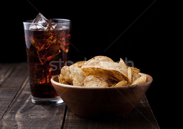 Crispy pepper crisps in wooden bowl with cola soda Stock photo © DenisMArt