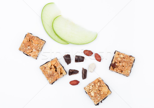 Cereal bar bits apple chocolate and peanuts Stock photo © DenisMArt