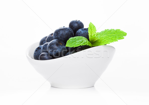 Fresh healthy organic blueberry in white bowl Stock photo © DenisMArt