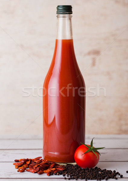 Bottle of spicy tomato juice with black pepper Stock photo © DenisMArt