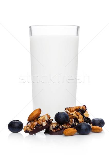 Cereal bar bits blueberries and glass of milk Stock photo © DenisMArt