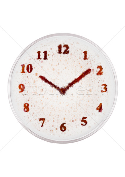 Glass of red ale beer top with clock shape Stock photo © DenisMArt