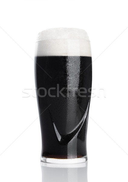 Vidrio oscuro cerveza espuma rocío blanco Foto stock © DenisMArt