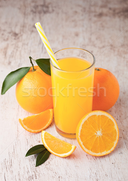 Glass of raw organic fresh orange juice with fruit Stock photo © DenisMArt