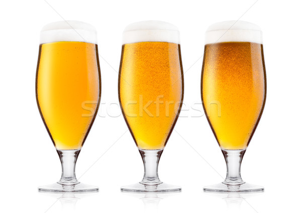 Cold glasses of lager beer with foam and dew Stock photo © DenisMArt