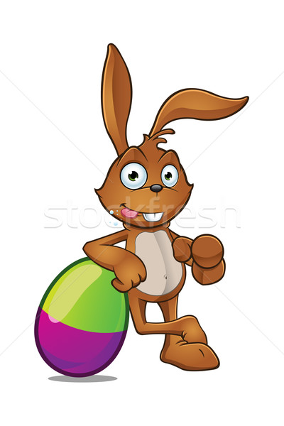 Easter Rabbit Leaning On Large Easter Egg Stock photo © DesignWolf