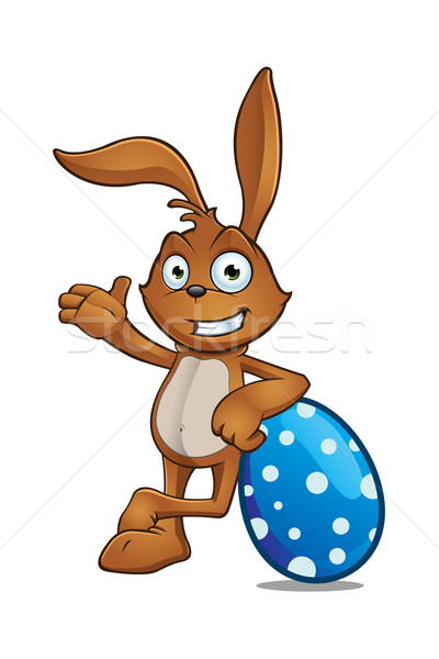 Easter Rabbit Leaning On Large Easter Egg Stock photo © DesignWolf